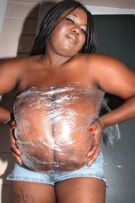 Huge black boobs in plastic